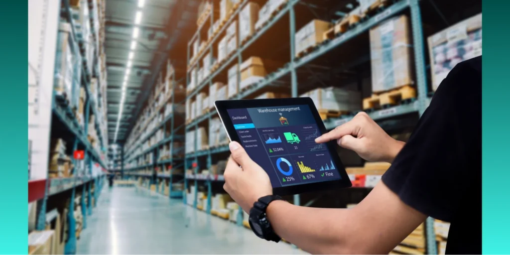 Person using a digital tablet to manage inventory in a warehouse, illustrating ISO Quality Management System processes for supply chain efficiency and real-time data monitoring