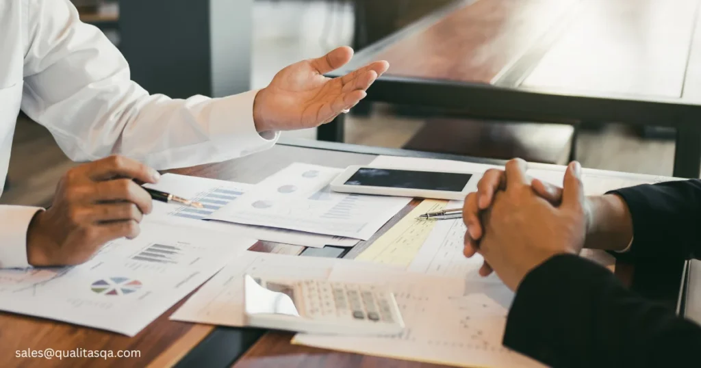 Business consultant providing financial reports and performance data to a client during a meeting, highlighting the factors that are considered critical for the audit of a company, including financial analysis, internal controls, risk assessment and compliance review. 