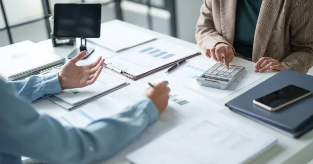 Professionals go over reports and financial docs together, planning their next move. Professional SOP writers support all this; boosting compliance, streamlining collaboration, and making business operations run smoother. 