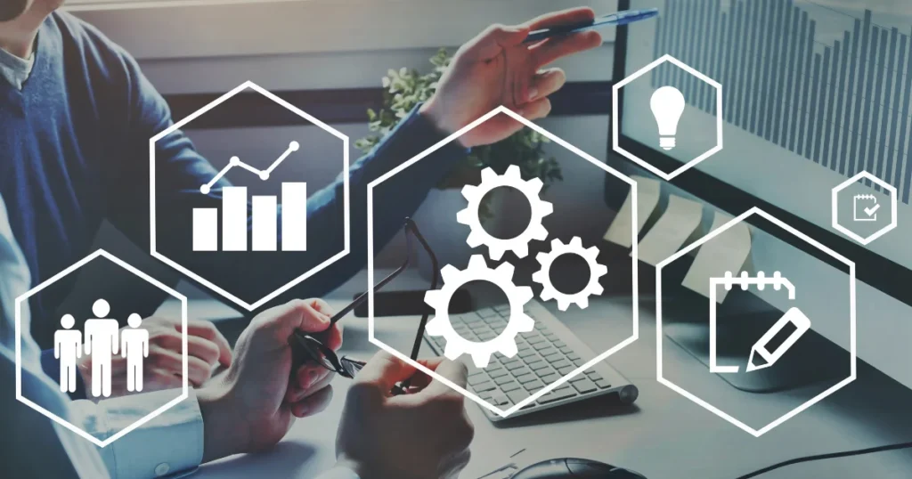 Business team reviewing workflows and performance data on a laptop, surrounded by icons for analytics, planning, technology, and productivity, representing business process management consulting.
