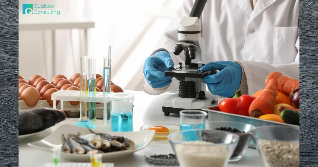 Food safety laboratory analysis showing a specialist examining food samples with a microscope, supporting HACCP Certification in Qatar and food safety management.